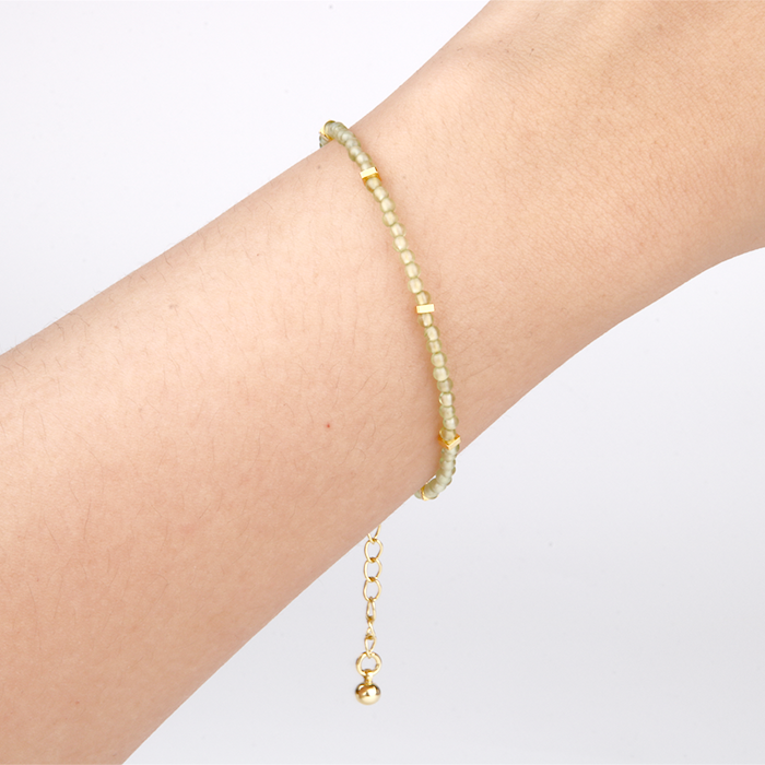peridot with 18k gold accent minimalist crystal bracelet for fashion outfit grounding energy and growth feminine energy crystal jewelry
