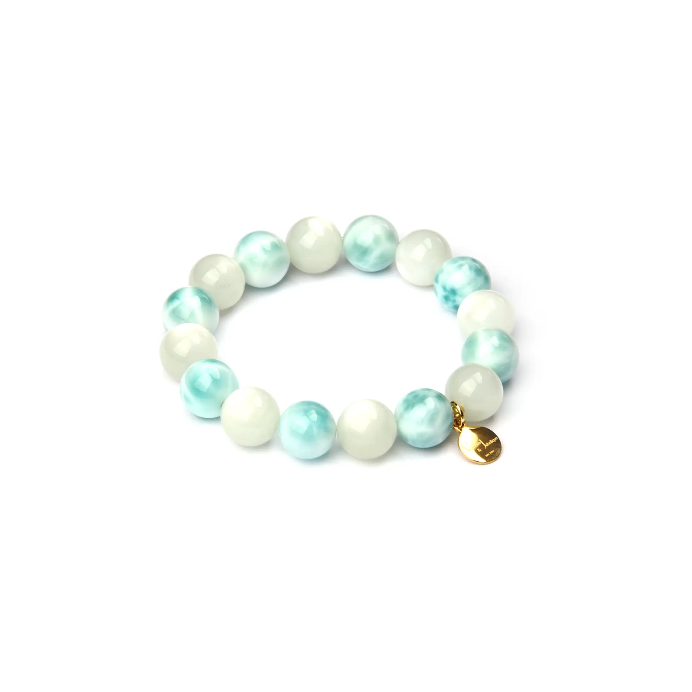 Beaded bracelet with white and light blue beads on a white background