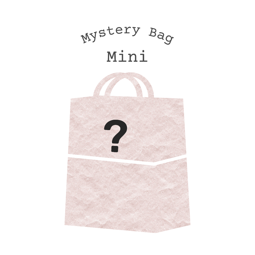 Pink mystery bag with a question mark on a white background, labeled 'Mystery Bag Mini'.