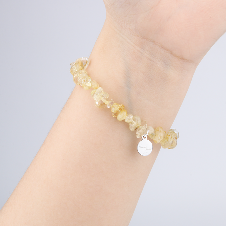 Minimalist chip crystal bracelet with raw-shaped citrine, showcasing golden hues and vibrant positive energy