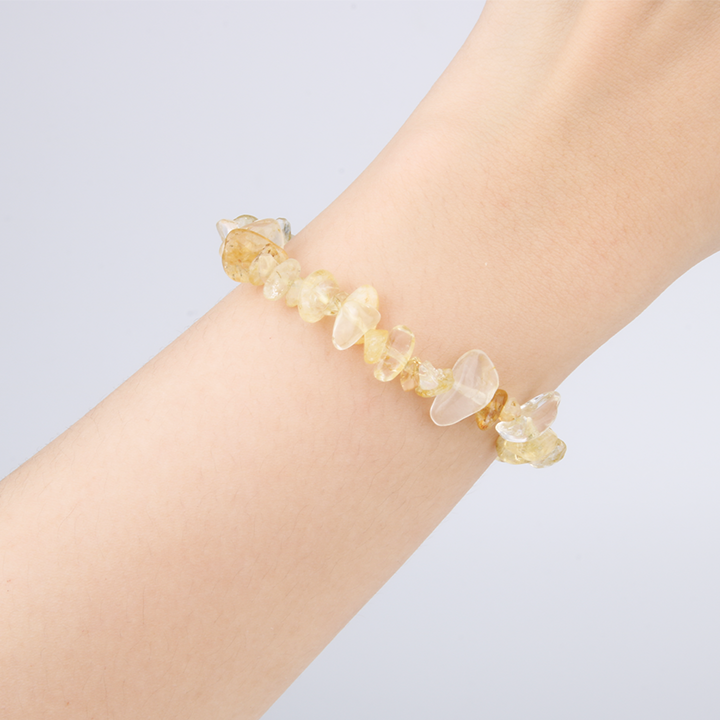 Minimalist chip crystal bracelet with raw-shaped citrine, showcasing golden hues and vibrant positive energy