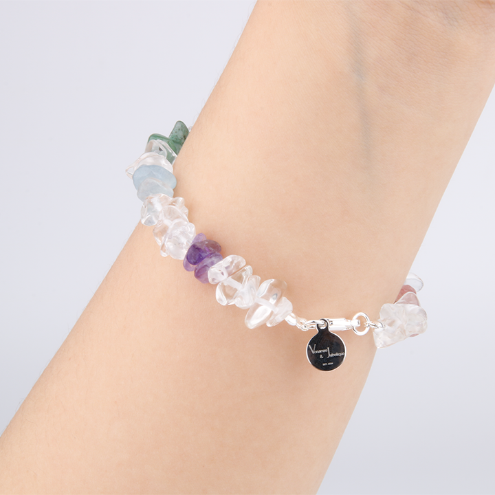 Rainbow chip crystal bracelet with raw-shaped clear quartz, strawberry rose quartz, red agate, citrine, aventurine, aquamarine, and amethyst in a minimalist design