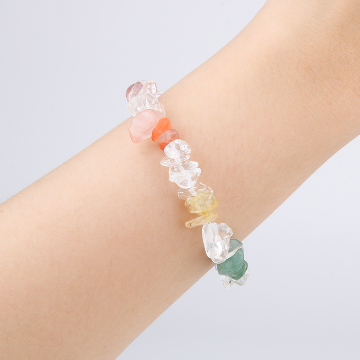 Rainbow chip crystal bracelet with raw-shaped clear quartz, strawberry rose quartz, red agate, citrine, aventurine, aquamarine, and amethyst in a minimalist design