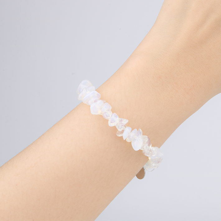Minimalist chip crystal bracelet with raw-shaped opal stones, showcasing an ethereal and natural crystal style