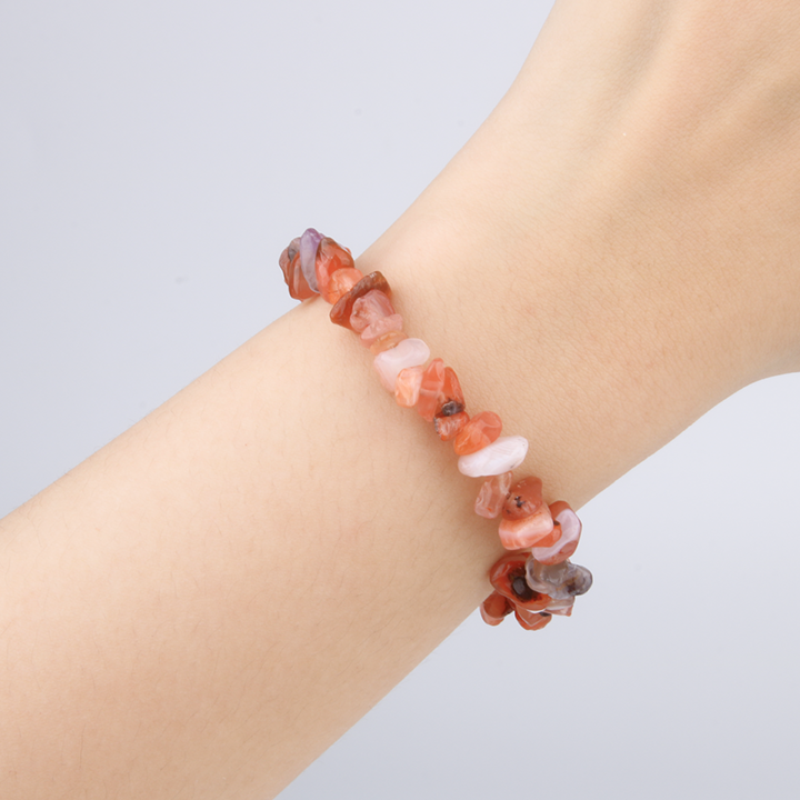 Minimalist chip crystal bracelet with raw-shaped red agate, featuring deep earthy tones and grounding crystal energy