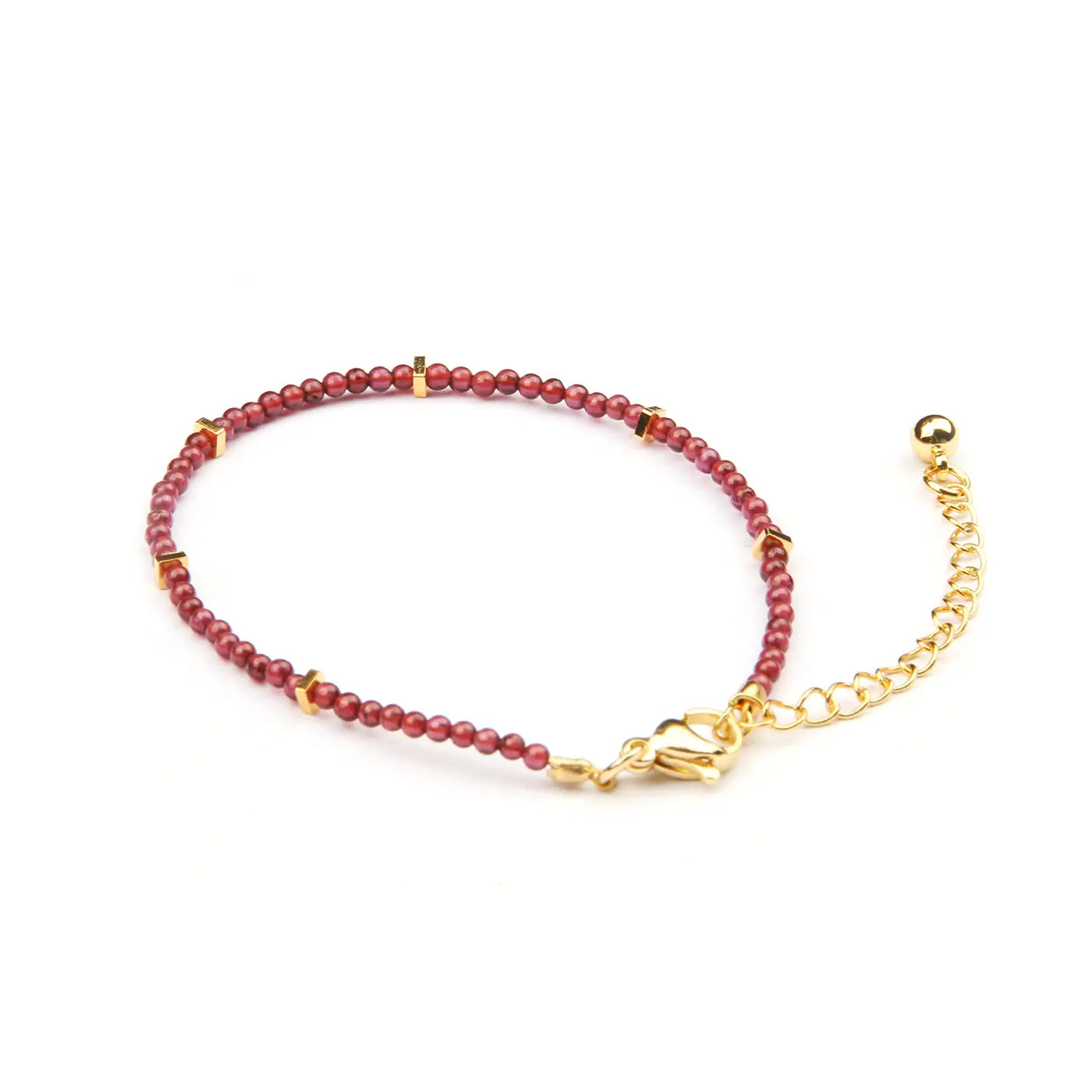 A beaded bracelet with small round red beads, accented with gold spacer beads and a gold lobster clasp, shown on a plain white background.