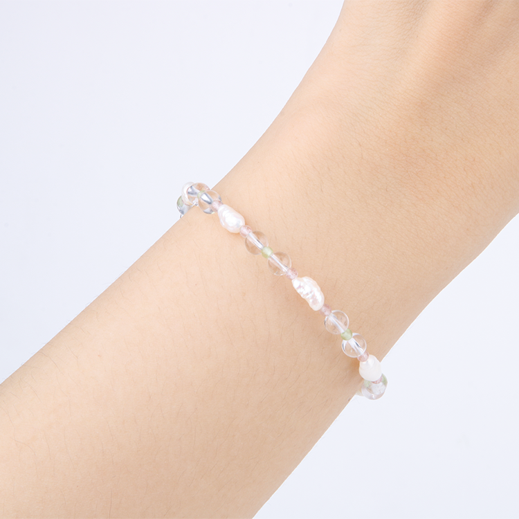 Minimalist bracelet with clear quartz, round strawberry rose quartz, round peridot, and freshwater pearl