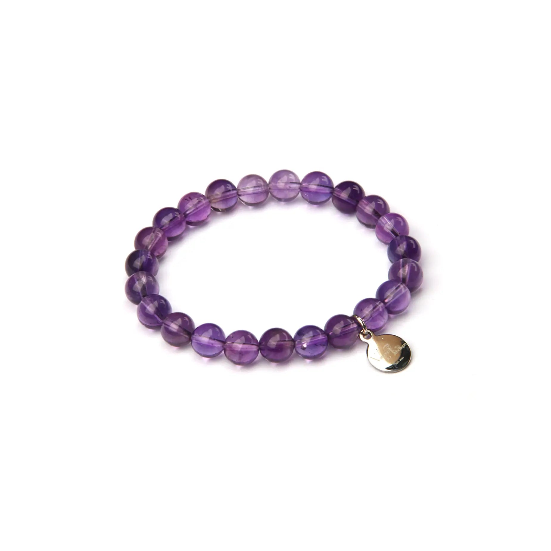 A purple amethyst beaded stretch bracelet with a small silver-toned teardrop charm, displayed on a clean white background.