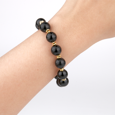 black tourmaline with 18k gold accent minimalist crystal bracelet for fashion outfit grounding energy and energy sheild crystal jewelry