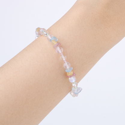 Delicate beaded bracelet with blue moonstone, clear quartz, strawberry rose quartz, aquamarine, and peridot in raw or round-shaped beads