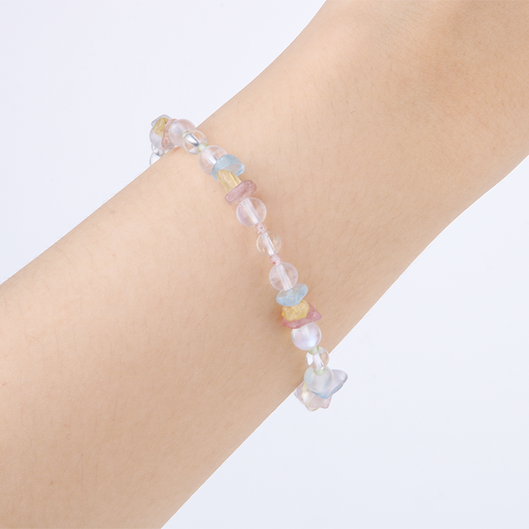 Delicate beaded bracelet with blue moonstone, clear quartz, strawberry rose quartz, aquamarine, and peridot in raw or round-shaped beads