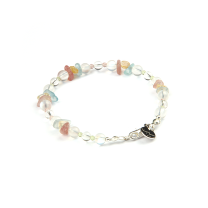 Delicate beaded bracelet with blue moonstone, clear quartz, strawberry rose quartz, aquamarine, and peridot in raw or round-shaped beads