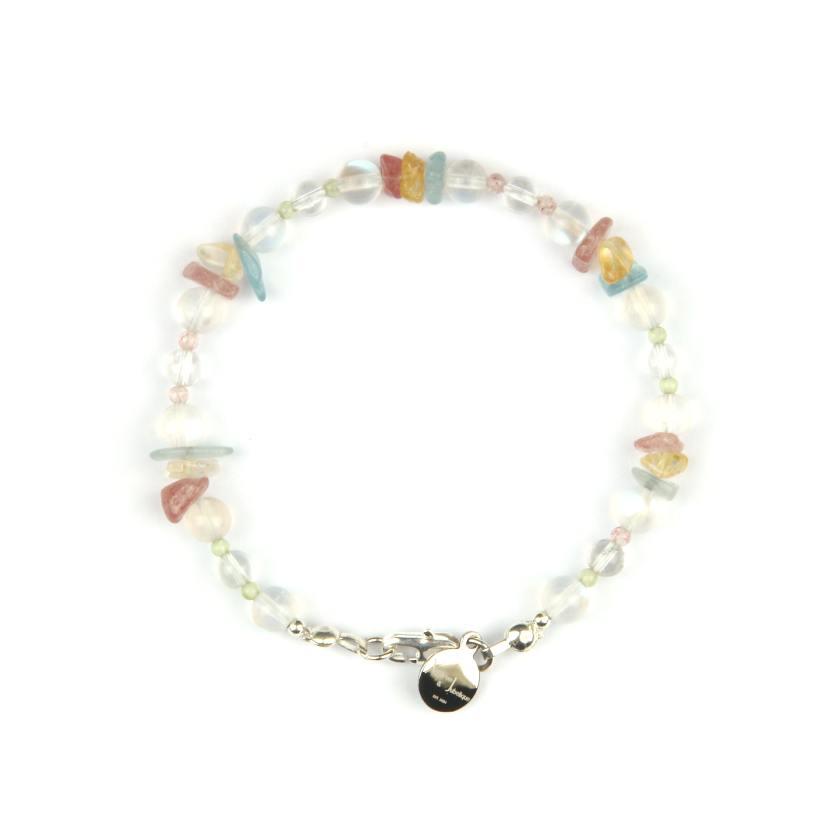 Delicate beaded bracelet with blue moonstone, clear quartz, strawberry rose quartz, aquamarine, and peridot in raw or round-shaped beads