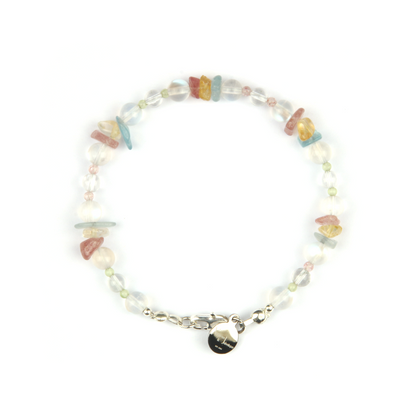 Delicate beaded bracelet with blue moonstone, clear quartz, strawberry rose quartz, aquamarine, and peridot in raw or round-shaped beads