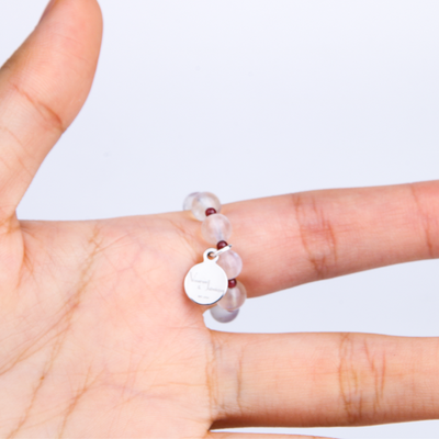 dainty beaded ring for everyday wear on blue moonstone with garnet