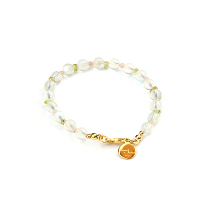 Minimalist bracelet with blue moonstone, round strawberry rose quartz, and raw-shaped peridot