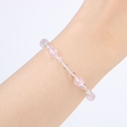 Elegant bracelet with clear quartz, blue moonstone, strawberry rose quartz, peridot, freshwater pearl, starlight rose quartz, and opal