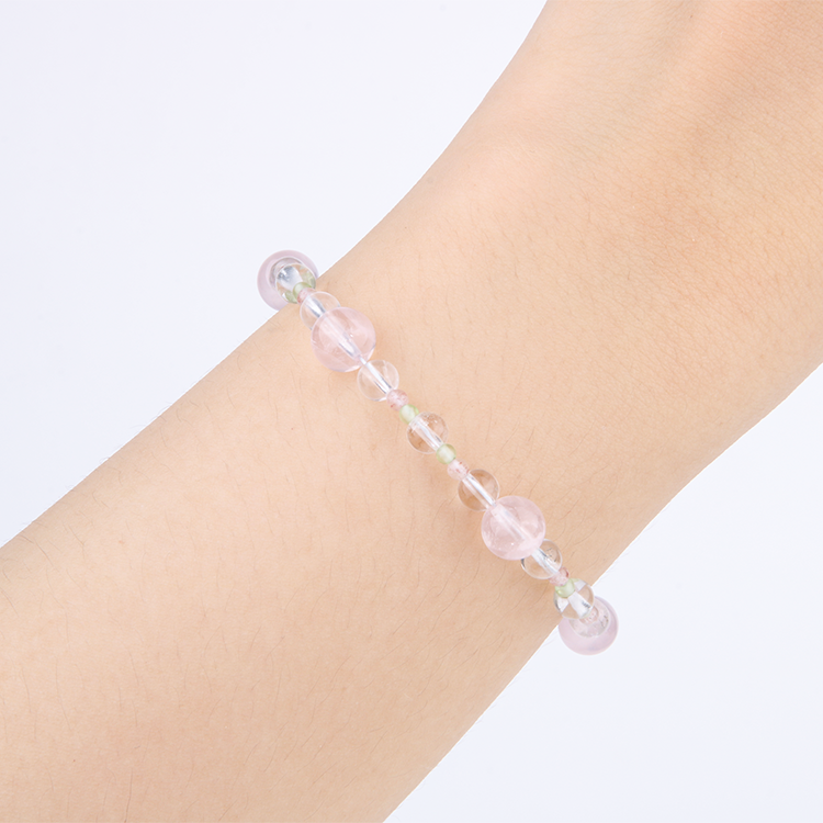 Elegant bracelet with clear quartz, blue moonstone, strawberry rose quartz, peridot, freshwater pearl, starlight rose quartz, and opal