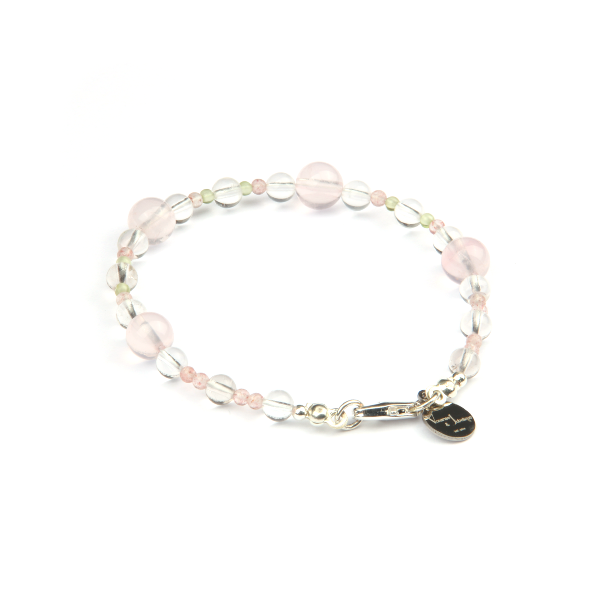 Minimalist bracelet with clear quartz, strawberry rose quartz, peridot, and starlight rose quartz
