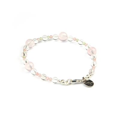 Minimalist bracelet with clear quartz, strawberry rose quartz, peridot, and starlight rose quartz