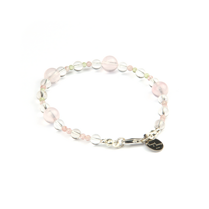 Minimalist bracelet with clear quartz, strawberry rose quartz, peridot, and starlight rose quartz