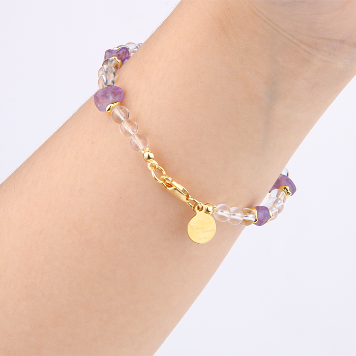 Minimalist crystal bracelet with clear quartz, raw-shaped amethyst, and 18K gold raw beads