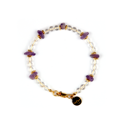 Minimalist crystal bracelet with clear quartz, raw-shaped amethyst, and 18K gold raw beads