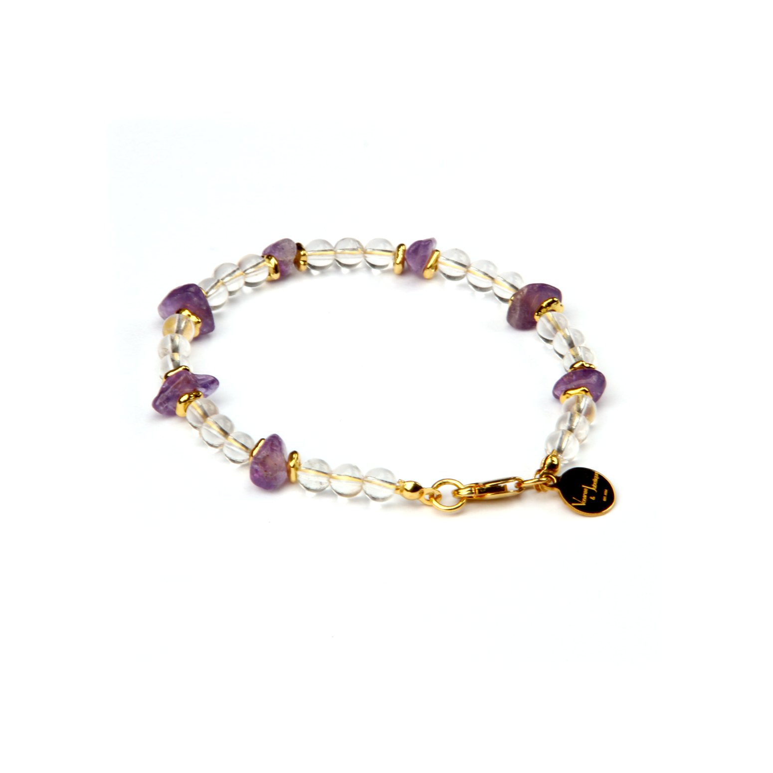Minimalist crystal bracelet with clear quartz, raw-shaped amethyst, and 18K gold raw beads