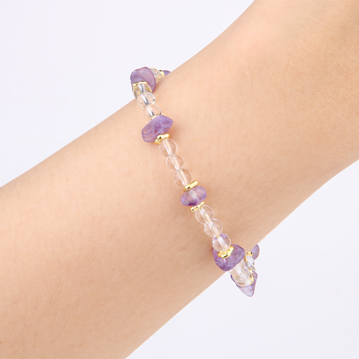Minimalist crystal bracelet with clear quartz, raw-shaped amethyst, and 18K gold raw beads