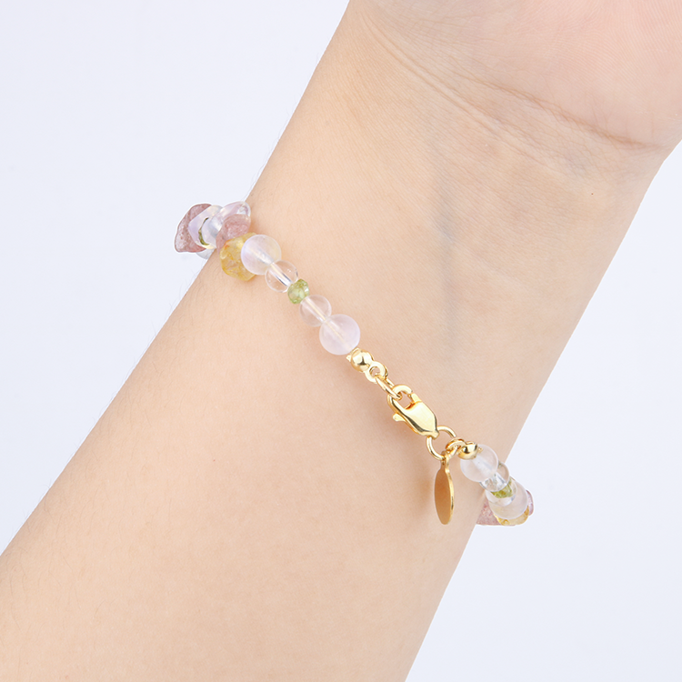 Minimalist bracelet with clear quartz, strawberry rose quartz, raw-shaped peridot, opal, citrine, and clear quartz beads