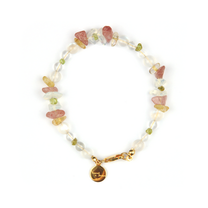 Minimalist bracelet with clear quartz, strawberry rose quartz, raw-shaped peridot, opal, citrine, and clear quartz beads
