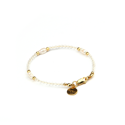 Minimalist extra thin crystal bracelet with freshwater pearls, 2mm faceted clear quartz, and 18K gold cat’s eye threaded beads, 2-5mm overall