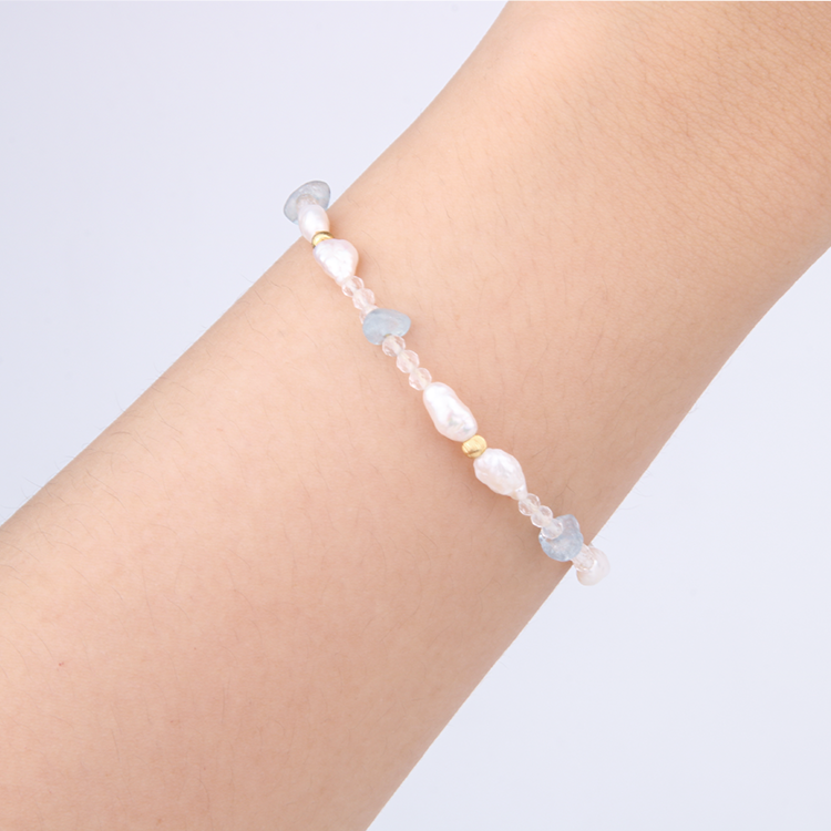 Minimalist extra thin crystal bracelet with freshwater pearls, chip aquamarine, 2mm faceted clear quartz, and 18K gold cat’s eye threaded beads, 2-5mm overall