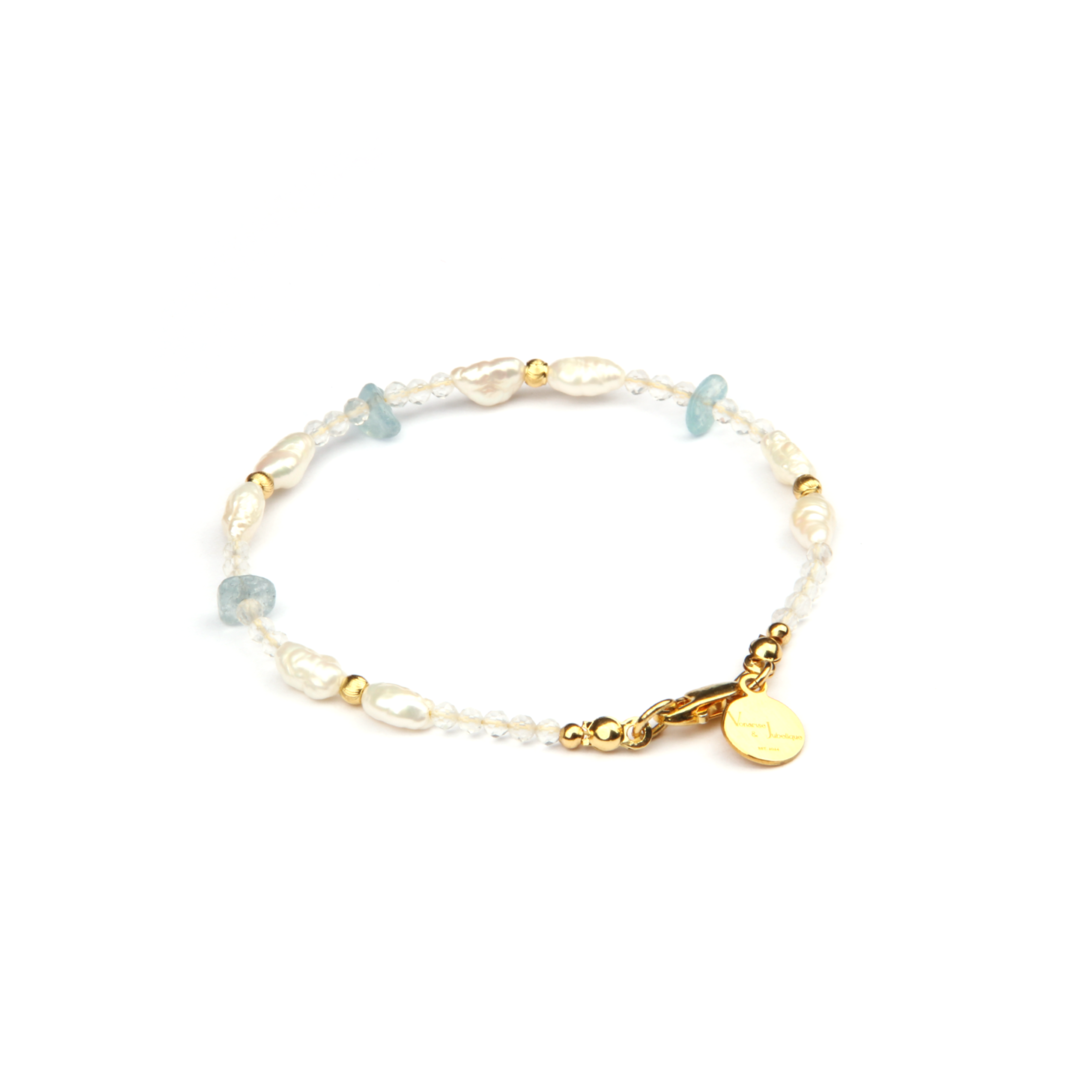 Minimalist extra thin crystal bracelet with freshwater pearls, chip aquamarine, 2mm faceted clear quartz, and 18K gold cat’s eye threaded beads, 2-5mm overall