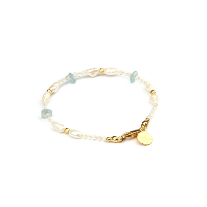 Minimalist extra thin crystal bracelet with freshwater pearls, chip aquamarine, 2mm faceted clear quartz, and 18K gold cat’s eye threaded beads, 2-5mm overall