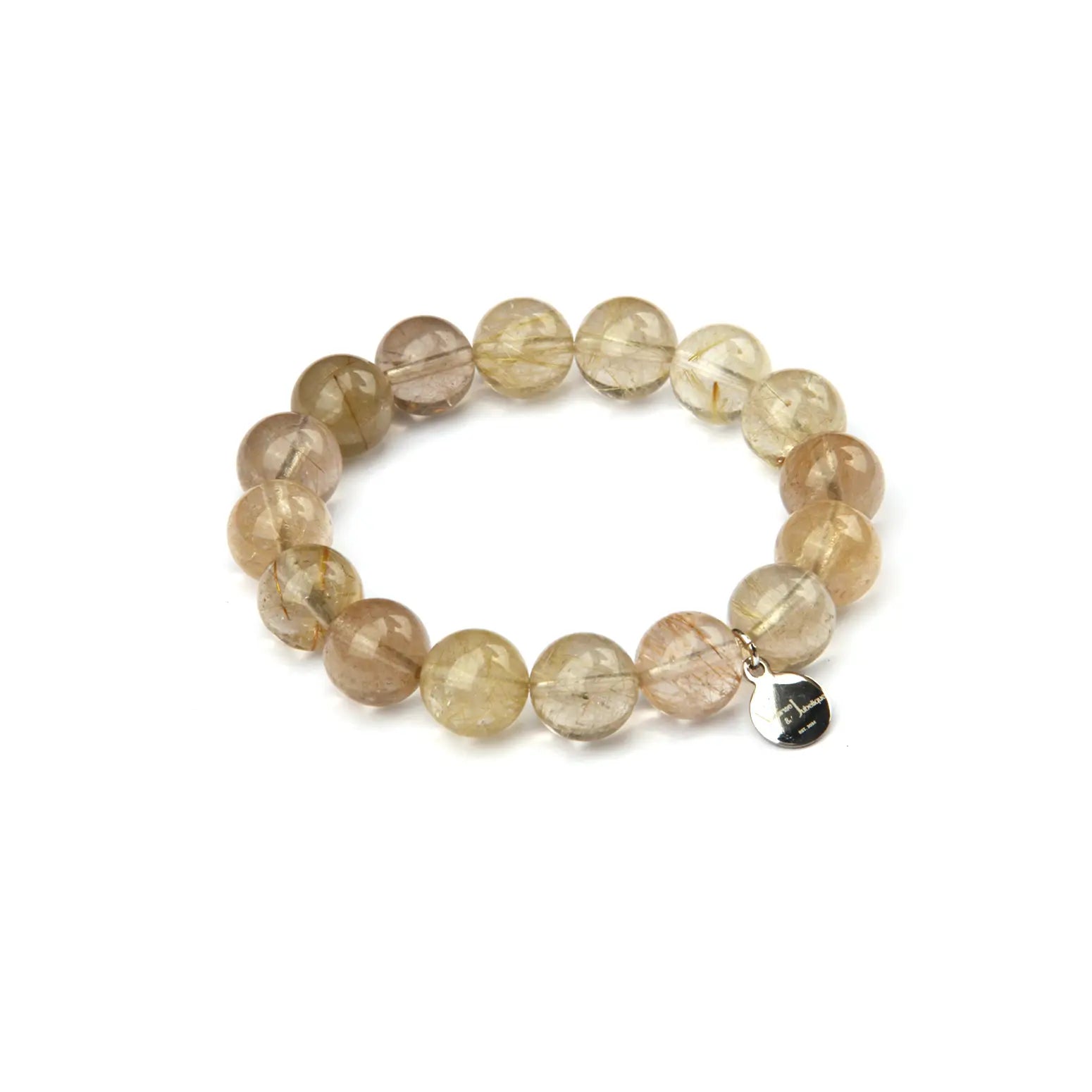 A beaded stretch bracelet made of round, translucent light brown and beige gemstone beads, featuring a small silver-toned metal charm, shown on a plain white background.