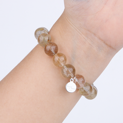 golden rutilated quartz crystal bracelet for abundance attraction
