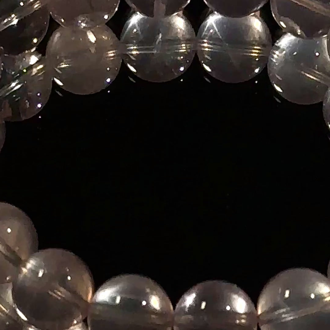 Load video: natural starlight rose quartz bracelet