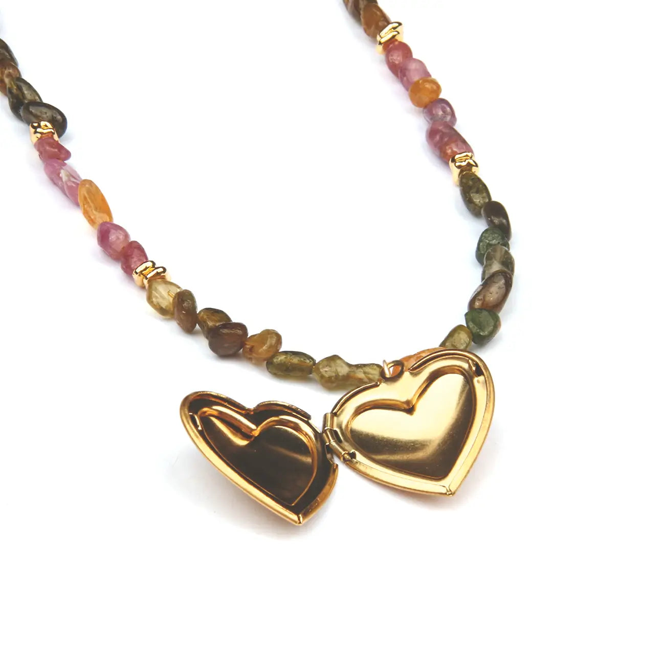 A beaded necklace featuring a split heart-shaped locket pendant in polished gold-tone metal, flanked by small natural gemstone beads in pink, orange, green, and brown, accented with gold spacer rings, on a white background.