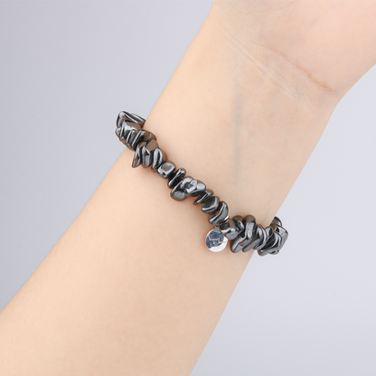 Minimalist chip crystal bracelet with raw-shaped hematite stones, offering a sleek and grounding metallic crystal look