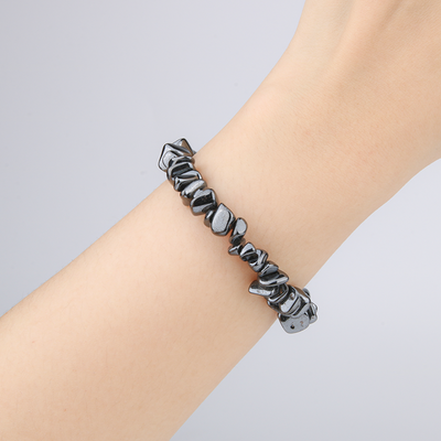 Minimalist chip crystal bracelet with raw-shaped hematite stones, offering a sleek and grounding metallic crystal look