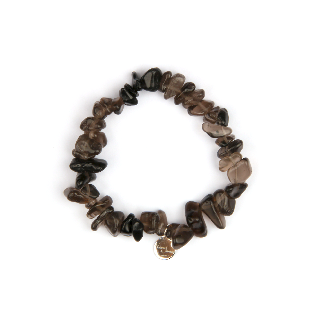 Minimalist chip crystal bracelet with raw-shaped smoky quartz stones, featuring a grounding and natural crystal aesthetic