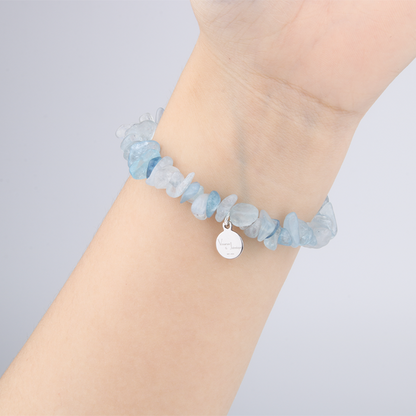 Minimalist chip crystal bracelet with raw-shaped aquamarine, featuring tranquil blue tones and calming oceanic crystal energy