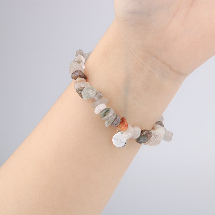 Minimalist chip crystal bracelet with raw-shaped bronze rutilated quartz, showcasing shimmering inclusions and a natural crystal elegance