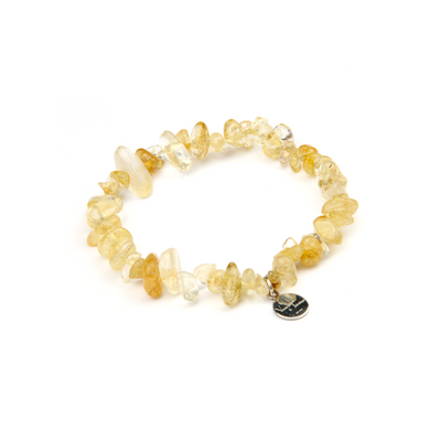 Minimalist chip crystal bracelet with raw-shaped citrine, showcasing golden hues and vibrant positive energy