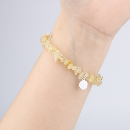 Minimalist chip crystal bracelet with raw-shaped citrine, showcasing golden hues and vibrant positive energy