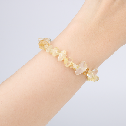 Minimalist chip crystal bracelet with raw-shaped citrine, showcasing golden hues and vibrant positive energy