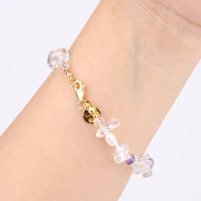 Minimalist bracelet with raw-shaped clear quartz, small round clear quartz, raw amethyst, and freshwater pearls