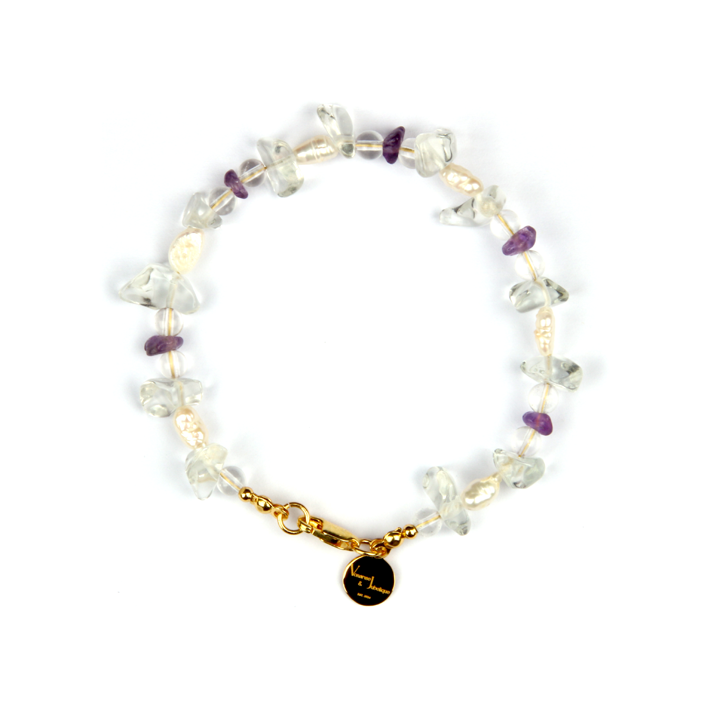Minimalist bracelet with raw-shaped clear quartz, small round clear quartz, raw amethyst, and freshwater pearls