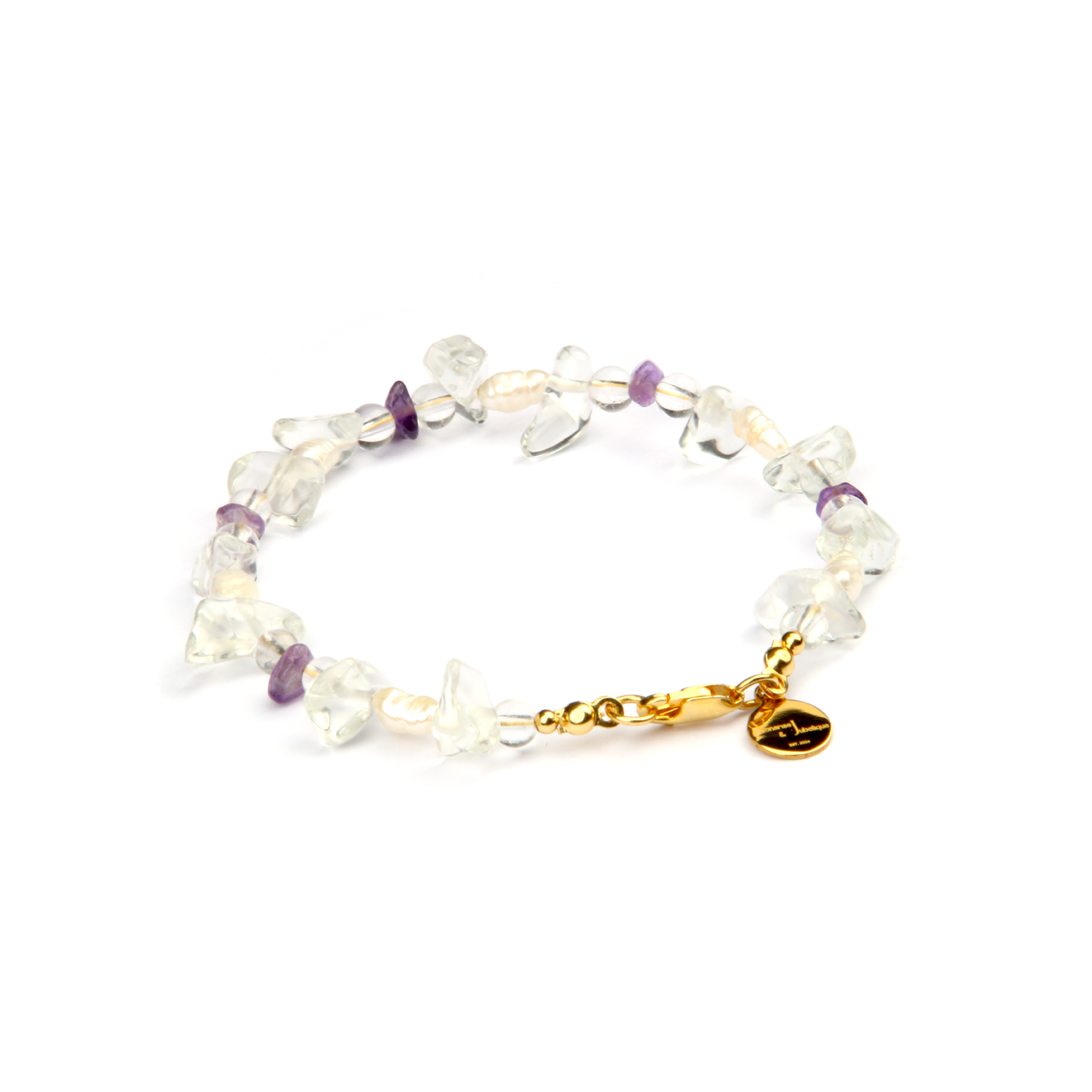 Minimalist bracelet with raw-shaped clear quartz, small round clear quartz, raw amethyst, and freshwater pearls